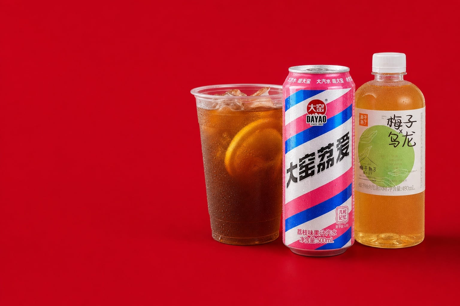 Iced lemon tea, a can of Dayao lychee soda and a bottle of Guozishule plum oolong, ice-cold on a red field